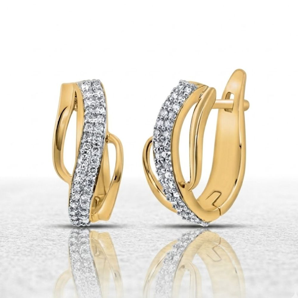 The 10K Diamond Hoop Earrings 1/4 CTTW Yellow Gold feature an elegant twist design with sparkling white stones along the front, shown on a reflective surface against a white background.
