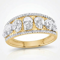 The 10K Yellow Gold Diamond Skull Men's Band Ring features detailed silver skulls across the band, bordered by sparkling diamonds—a striking, bold, and edgy accessory for men.