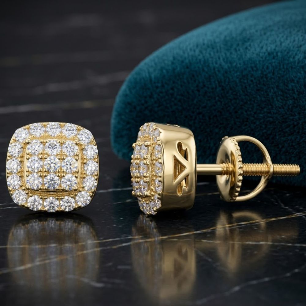 Yellow Tone Moissanite Square Stud Earrings 0.94ct with sparkling faceted faces, shown on a dark marbled surface next to a teal fabric pouch.
