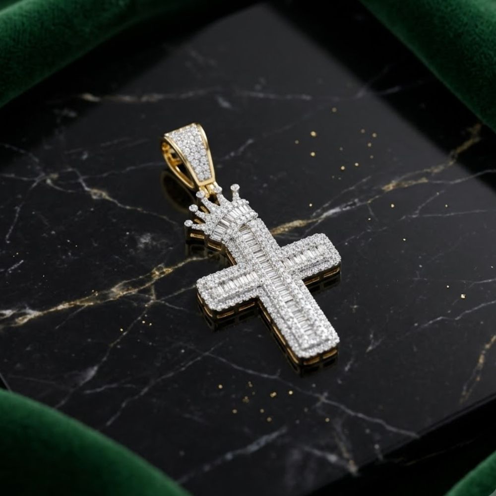 Crafted in 10K yellow gold, the 1 CTW Diamond Cross Crown Charm features a jeweled crown atop a diamond-encrusted cross pendant, shown on black marble bordered with green velvet.
