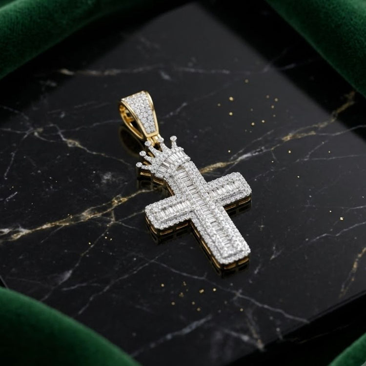 Crafted in 10K yellow gold, the 1 CTW Diamond Cross Crown Charm features a jeweled crown atop a diamond-encrusted cross pendant, shown on black marble bordered with green velvet.