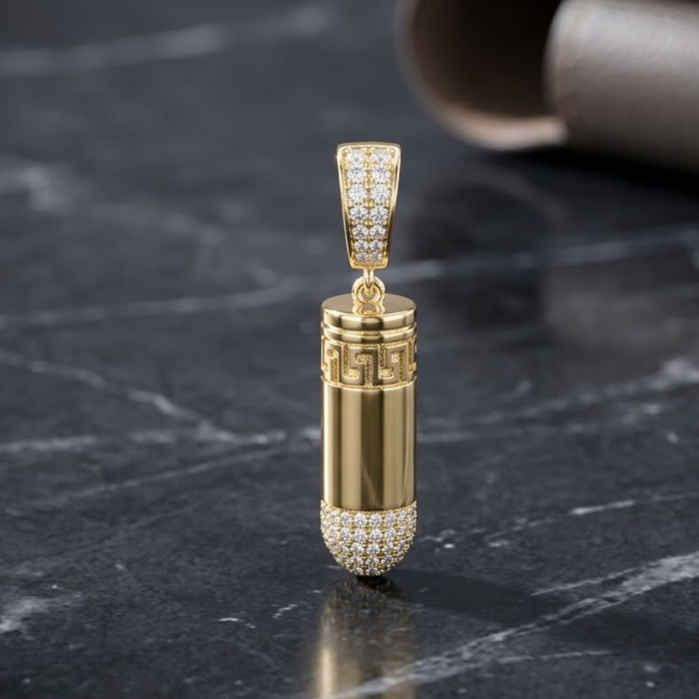 The 5/8CTW Diamond Urn Charm in 10K yellow gold features a capsule design with a Greek key pattern and sparkling white gemstones on each end, making it a striking men's jewelry piece.