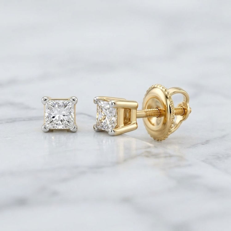 14k Yellow Gold Princess Diamond Solitaire Earrings featuring princess-cut diamonds set in 14k yellow gold with screw backs.