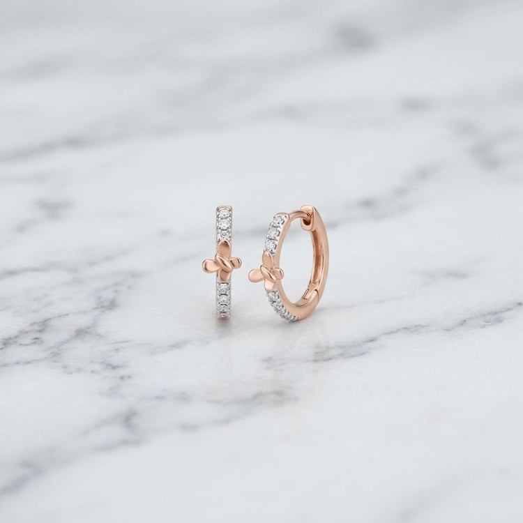 1/12CTW Natural Diamond Butterfly Hoop Earrings in 10k gold, each featuring a small accent and a row of embedded natural diamonds.