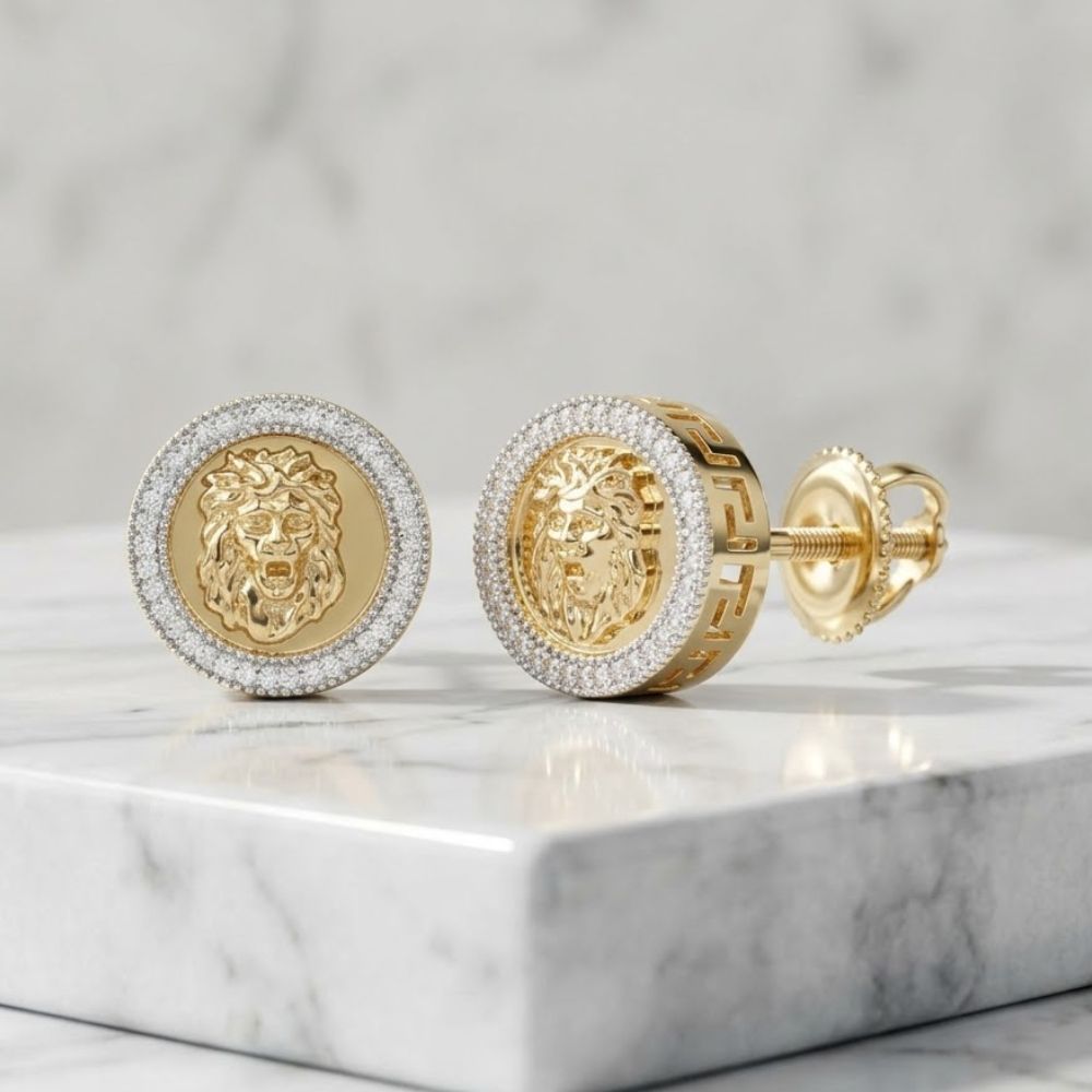 A pair of 10K yellow gold cufflinks with detailed lion heads and a border of sparkling stones, displayed on white marble. Pairs perfectly with our 1/4CTW Diamond Lion Stud Earrings for Men in 10K yellow gold for a bold statement look.
