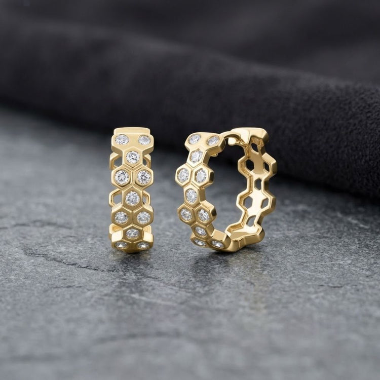 1/3CTW Natural Diamond Hoop Huggies 10K Gold earrings featuring a honeycomb-shaped design with round natural diamonds set in the center of each cell.