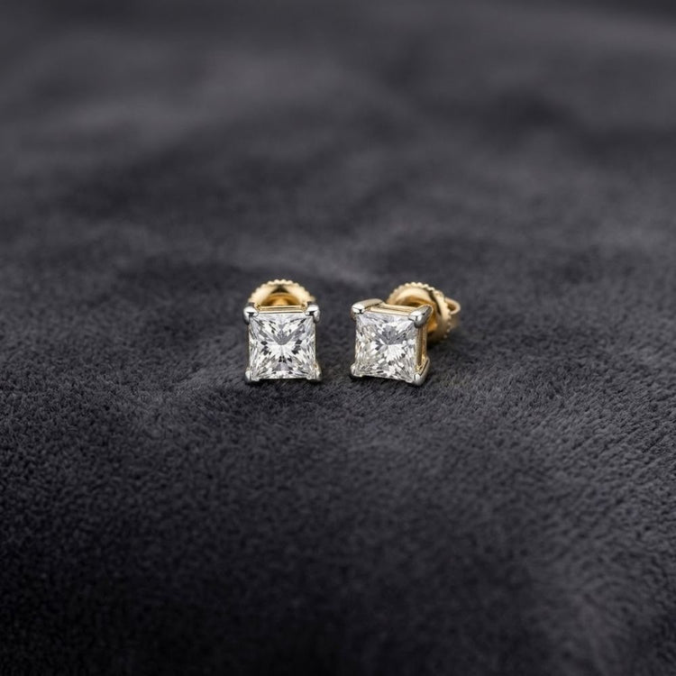 14k Yellow Gold Princess Diamond Solitaire Earrings featuring princess-cut diamonds set in 14k yellow gold prongs.