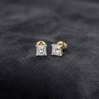 14k Yellow Gold Princess Diamond Solitaire Earrings featuring princess-cut diamonds set in 14k yellow gold prongs.