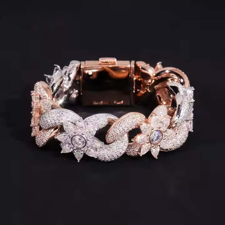 The Silver Moissanite Flower Infinity Bracelet features sterling silver with rose gold accents, floral and leaf motifs, and sparkling moissanite stones, beautifully displayed on a black background.