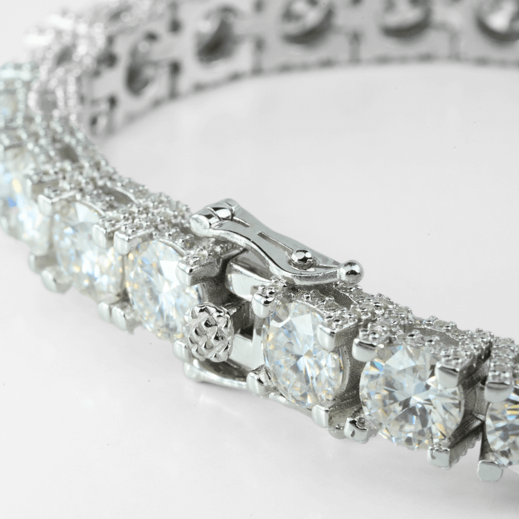 Close-up of the Fully Iced Out Moissanite Tennis Bracelet crafted in elegant 925 sterling silver, showcasing large round-cut clear gemstones in prong settings and a detailed locking clasp, set against a white background.
