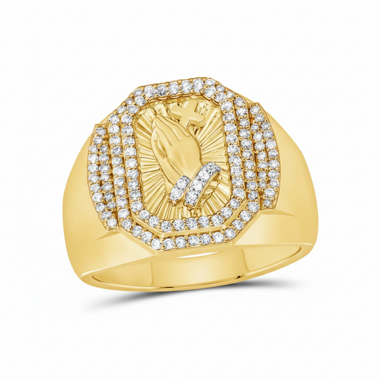 The 1/2CTW Diamond Praying Hands Cross Men’s Ring in 10k gold features engraved praying hands holding a cross, accented with diamond rows on a broad polished band.