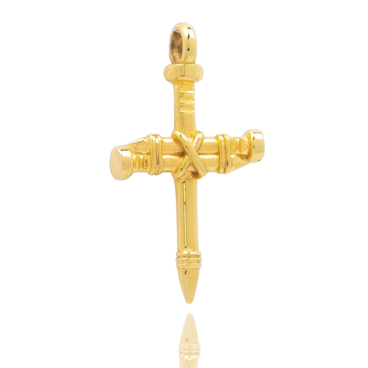 The Gold Nail Cross Pendant features two intersecting nails with detailed engravings, crafted in 10K or 14K gold. This striking Christian jewelry piece reflects light beautifully against a white background.