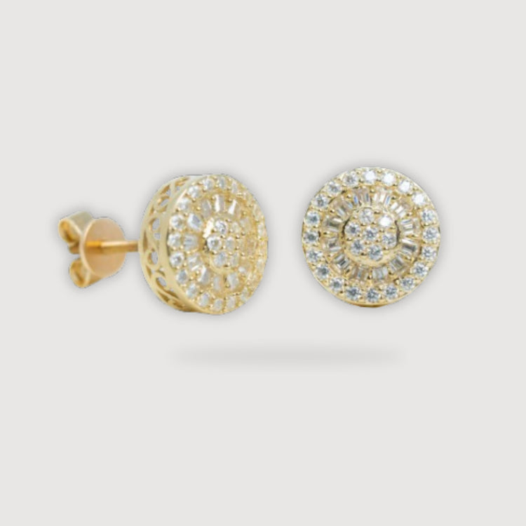The Round Baguette Stud Moissanite Earrings in 10k yellow gold feature intricate filigree and sparkling moissanite stones set in concentric circles, displayed on a light background.