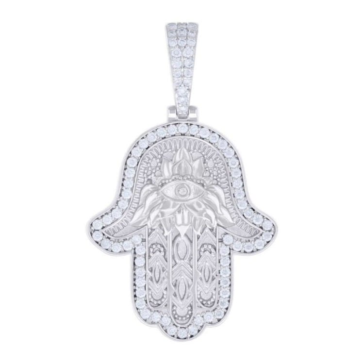 The Moissanite Hamsa Symbol Charm Pendant is crafted from 925 sterling silver and features a gemstone-encrusted eye, engraved symmetrical patterns, and a sparkling gemstone-studded bail for an elegant touch.