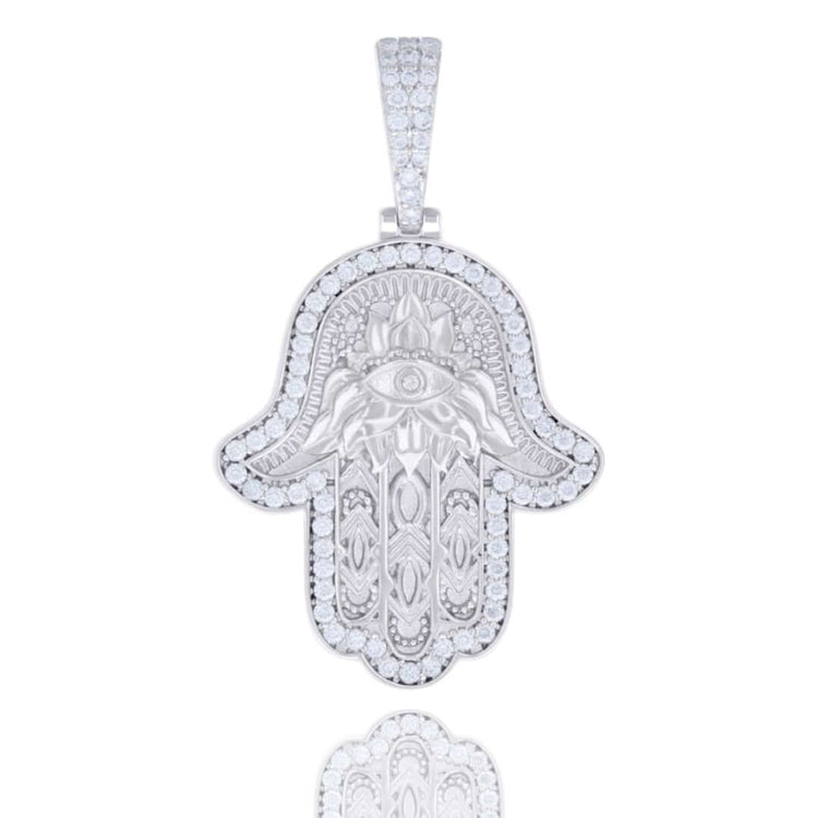 The Moissanite Hamsa Symbol Charm Pendant features a 925 sterling silver design with an engraved eye, intricate center patterns, and clear round moissanite stones—an elegant and symbolic necklace.