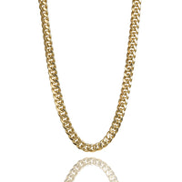 The Hollow Gold Cuban Link Chain 7.5mm - 15mm is shown against a white background, highlighting its thick, interlocking links and casting a subtle reflection beneath the lightweight chain.