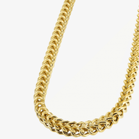 A close-up of the Franco Chain - 2mm-7mm Hollow Yellow Gold, featuring interlocking links in a V-shape, displayed against a plain white background.