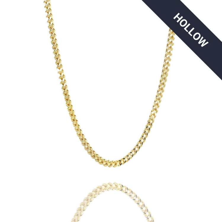 A Franco Chain - 2mm-7mm Hollow Yellow Gold is displayed on a white background with a navy "HOLLOW" banner in the top right corner. The hollow yellow gold chain shines, resembling classic Franco styles, with its reflection shown below.