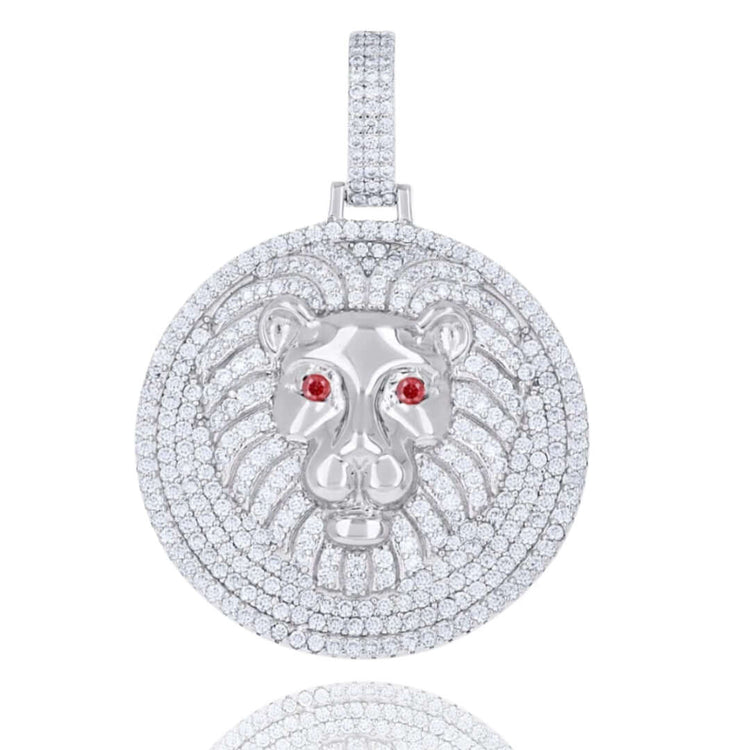 The Silver Ice Out Lion Head Charm Pendant features a round 925 sterling silver design with moissanite stones, a raised lion face, red gemstone eyes, and a diamond-covered bail for bold elegance.