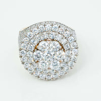 A close-up of the Iced-Out 8.96 CT Lab Diamond Cluster Ring, showcasing a large round cluster of lab diamonds in concentric rows, all set on a striking 14k yellow gold band.