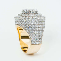 The Iced-Out 8.96 CT Lab Diamond Cluster Ring in 14K yellow gold features multiple rows of round white lab diamonds and a large raised circular diamond cluster, all set against a plain white background.