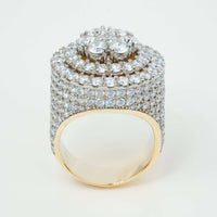 The Iced-Out 8.96 CT Lab Diamond Cluster Ring in 14k yellow gold features a thick, wide band fully encrusted with rows of lab diamonds and topped with a striking circular cluster—an eye-catching men’s statement ring.