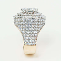 A close-up of the Iced-Out 8.96 CT Lab Diamond Cluster Ring in 14k yellow gold displays its rows of sparkling lab diamonds, creating an elaborate and sophisticated men's statement piece against a simple background.
