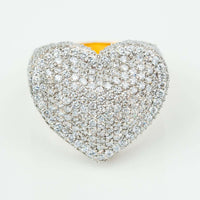 The Iced-Out Heart Cluster Ring 5.46 CT Diamond - 14k Yellow Gold features a dazzling heart-shaped cluster of white diamonds, displayed on a clean, white background.