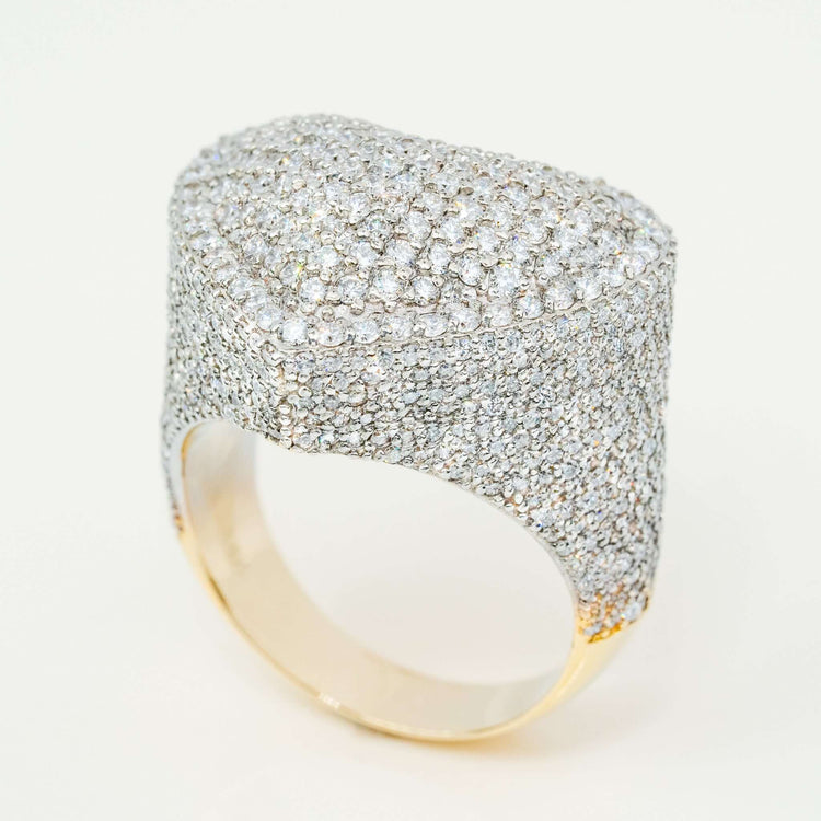 The Iced-Out Heart Cluster Ring 5.46 CT Diamond in 14K Yellow Gold showcases a thick, raised heart top encrusted with sparkling diamonds for a textured, luxurious style.