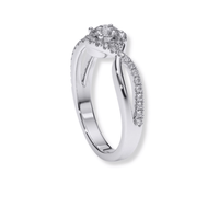 The Infinity Halo Lab Diamond Engagement Ring showcases a round lab diamond center with a pavé split shank in white gold, elegantly displayed on a white background—perfect for those seeking classic style.