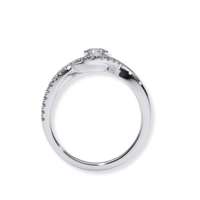 The Infinity Halo Lab Diamond Engagement Ring features a silver band with a prong-set round lab diamond center and small diamonds along the top half, shown from the side.