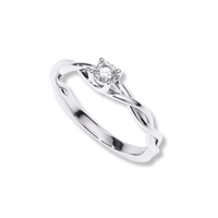 The Infinity Twist Lab Grown Diamond Solitaire Engagement Ring features a single round lab diamond at the center on a silver infinity twist band.