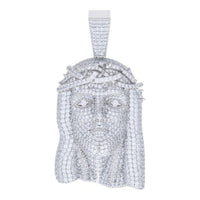 The Moissanite Jesus Religious Charm Pendant features a detailed face with a crown of thorns and sparkling white stones. Its rectangular bail allows easy attachment to a chain, blending elegance with spiritual meaning.