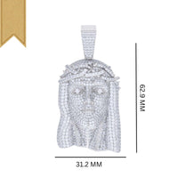 The Moissanite Jesus Religious Charm Pendant, shaped like a crowned face and detailed with sparkling stones and a gold ribbon in the top left, measures 62.9mm by 31.2mm—a striking piece of religious jewelry.