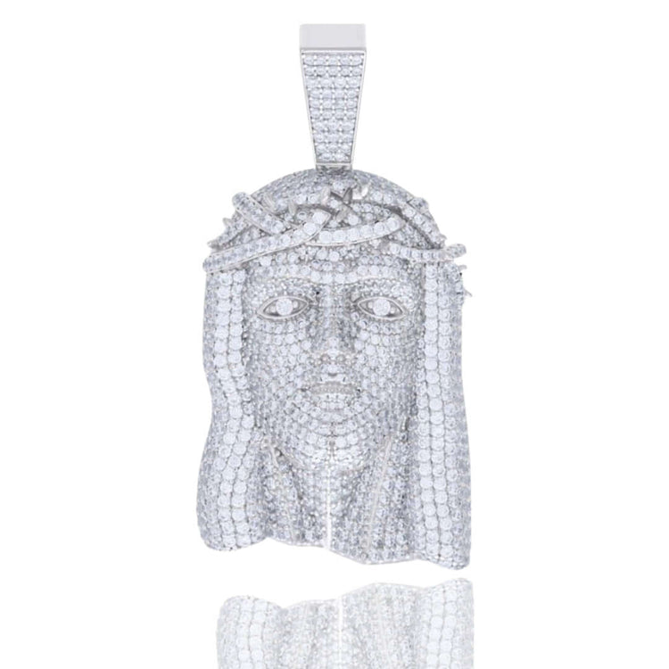 The Moissanite Jesus Religious Charm Pendant features a human face with a crown of thorns, detailed facial features and hair, sparkling with small stones—a standout religious jewelry piece that hangs from a rectangular bail.
