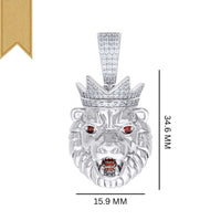 The King Lion Head Charm Pendant - Silver Moissanite features 925 sterling silver, a crown, VVS moissanite stones, vivid red gemstone eyes, open mouth, gold ribbon at top left; measures 34.6 mm tall x 15.9 mm wide.