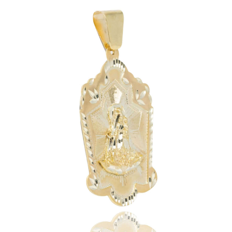 Men’s gold jewelry: The Lady Charity Caridad del Cobre Pendant in 10k solid gold features an intricate robed figure framed by a scalloped, decorative border with a reflective finish.