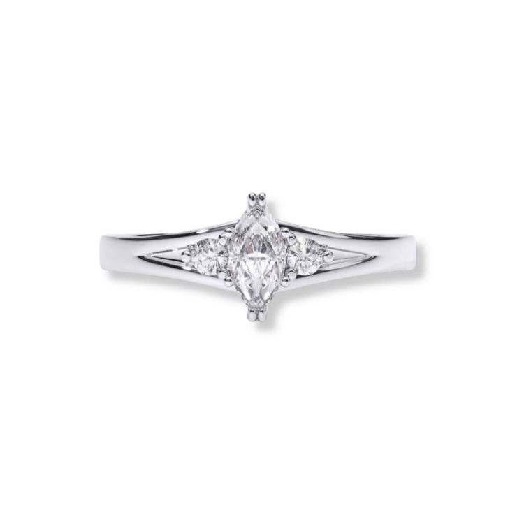 The Marquise Lab Diamond Three-Stone Engagement Ring in Platinum Finish features a marquise-cut lab diamond center, flanked by two small round diamonds on each side, all set on a simple polished band.