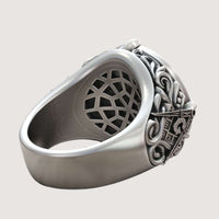 The Masonic All-Seeing Eye Pyramid Illuminati Ring features intricate, raised scrollwork and shield-like designs on the sides, shown from an angled side view against a plain light background.