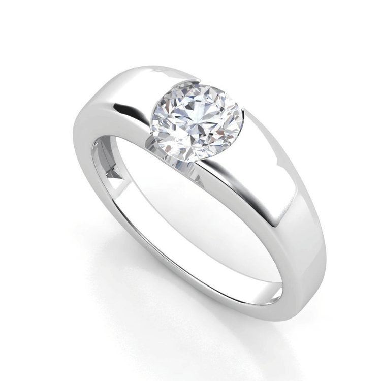 A men’s wedding band with a wide silver band features a 3 carat round-cut lab-grown diamond centerpiece set in a modern half-bezel style.