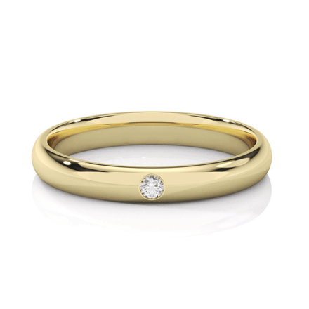 The Men's Wedding Band Center Stone Lab Grown Diamond - 3mm is a sleek yellow gold ring with a single small round lab diamond set flush in the band, shown on a white background.