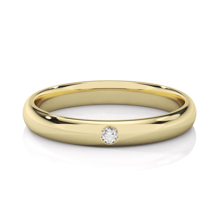 The Men's Wedding Band Center Stone Lab Grown Diamond - 3mm is a sleek yellow gold ring with a single small round lab diamond set flush in the band, shown on a white background.