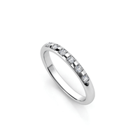 A men's wedding band in white gold, set with lab grown diamonds in an eternity style across the top half of the band, shown on a white background.