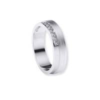 The Men's Wedding Band White Gold with Lab Diamond Channel showcases a brushed silver finish and a row of sparkling lab diamonds in a side channel, elegantly displayed on a plain white background.