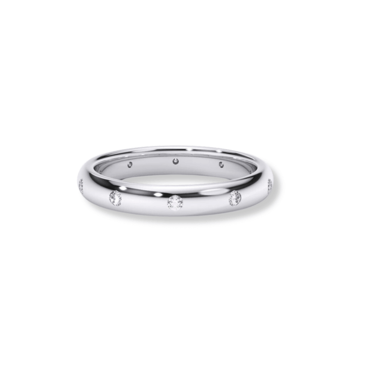 A sleek men's wedding band in white gold featuring small lab diamonds evenly spaced around the band, shown against a white background.