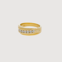 The Men's Wedding Ring Multi-Stone Diamond in 14K yellow gold features a smooth, wide band with seven round white diamonds set horizontally—a striking and elegant choice for a wedding ring.