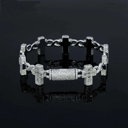 The Moissanite Cross Bracelet – 925 Sterling Silver features an intricate, chunky link design encrusted with sparkling stones, shown against a glossy black background—a bold statement of faith jewelry.
