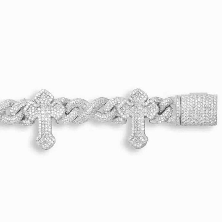 The Moissanite Cross Bracelet – 925 Sterling Silver features two diamond-studded cross pendants and a rectangular, gem-encrusted clasp. It is adorned with sparkling moissanite stones for an elegant finish.