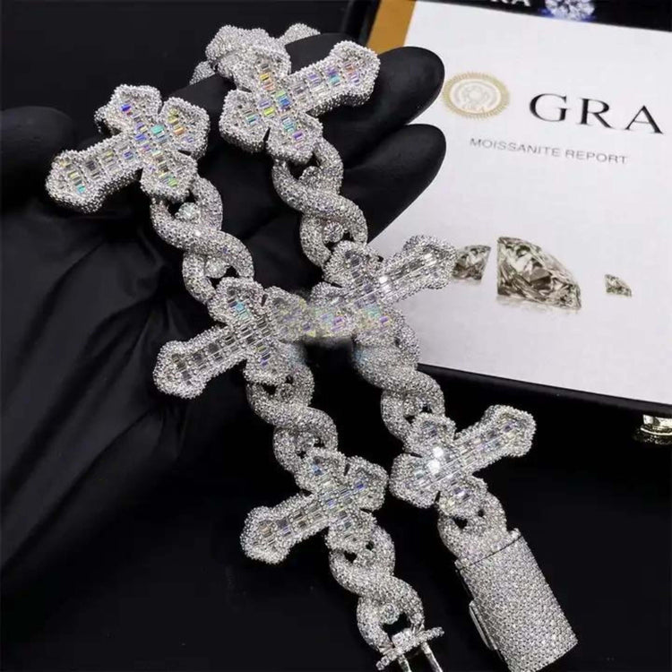 A gloved hand displays the Moissanite Cross Bracelet – 925 Sterling Silver, encrusted with diamonds and featuring a bold cross pendant, alongside a matching necklace, gem certificate, and diamond image in the background.
