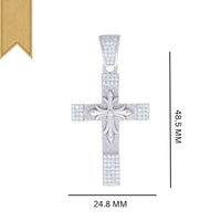 The Moissanite Cross Religious Pendant features a silver cross with a central fleur-de-lis design, small sparkling stones, and a gold ribbon in the top left. It measures 48.5 mm tall by 24.8 mm wide.
